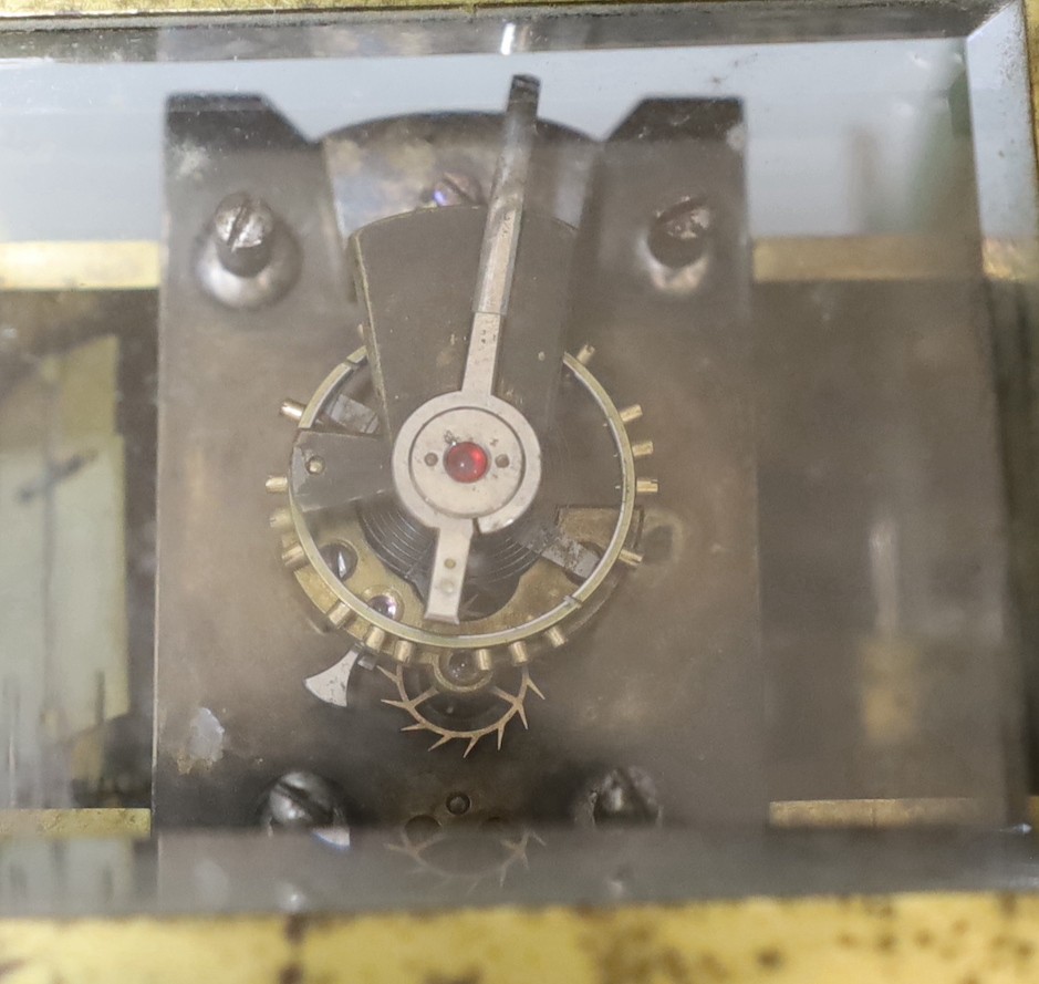 A large French repeating carriage clock with alarm, 16cm. High with handle down and a carriage timepiece